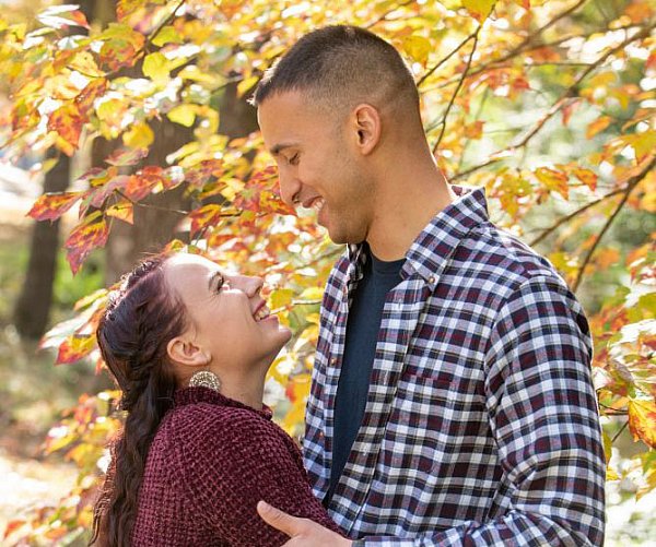 couple outside looking into each others eyes